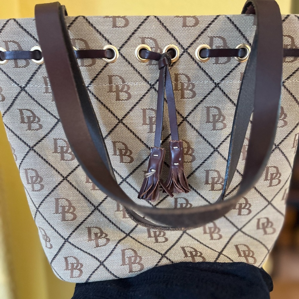 Gently used Dooney & Burke monogram bag. The colors are brown and tan.